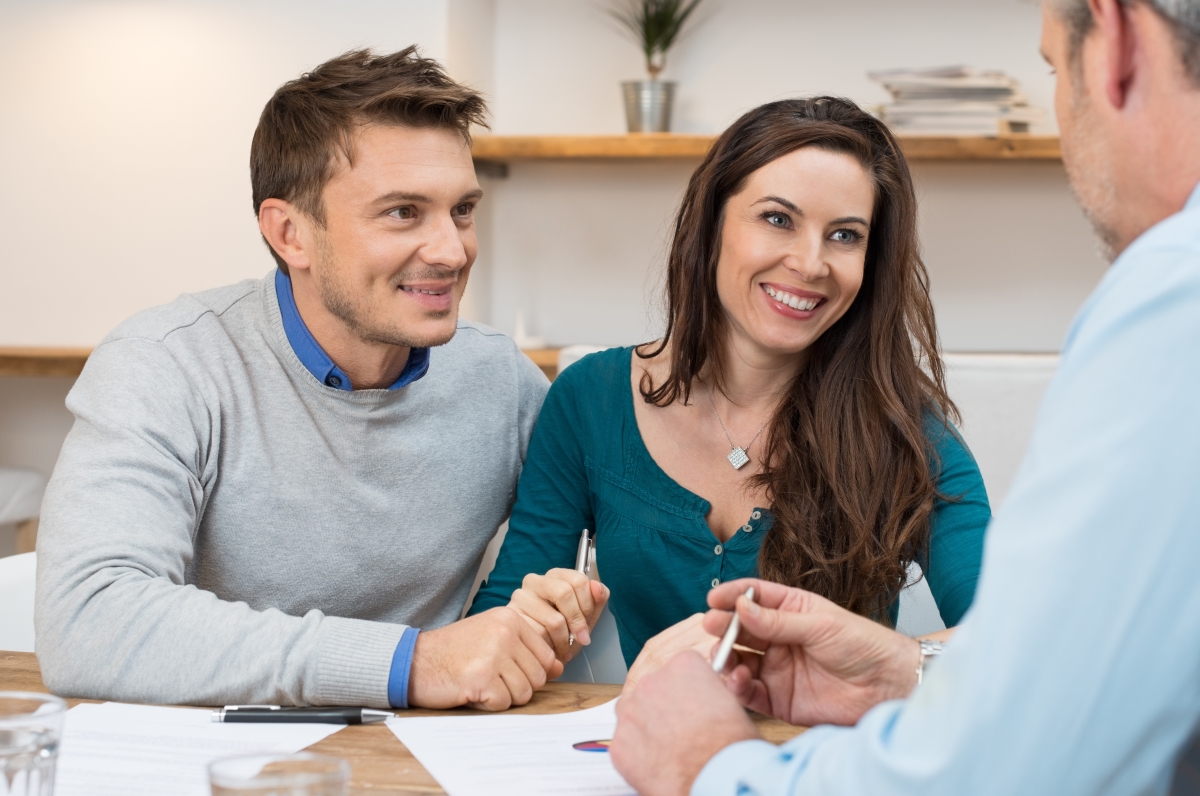 Loan officer explains to couple what a pre-approval is and why they need one
