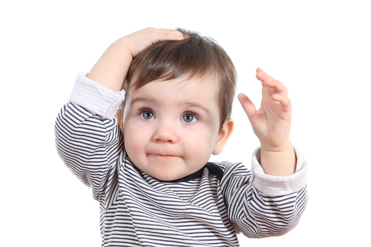 Image of child with hands on her head indicating that she did something wrong. Oops!