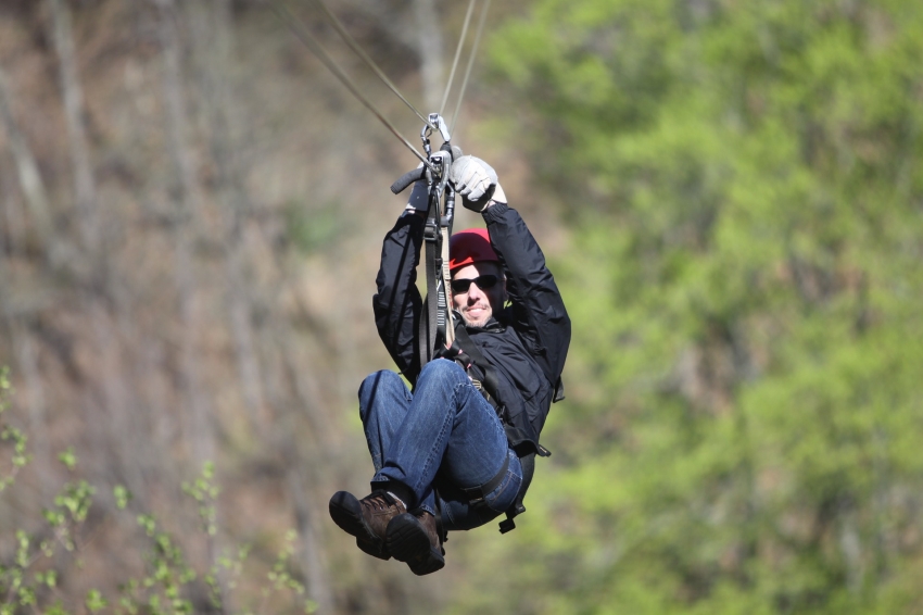 Image of Zipline rider in Hidden Valley in Wildwood